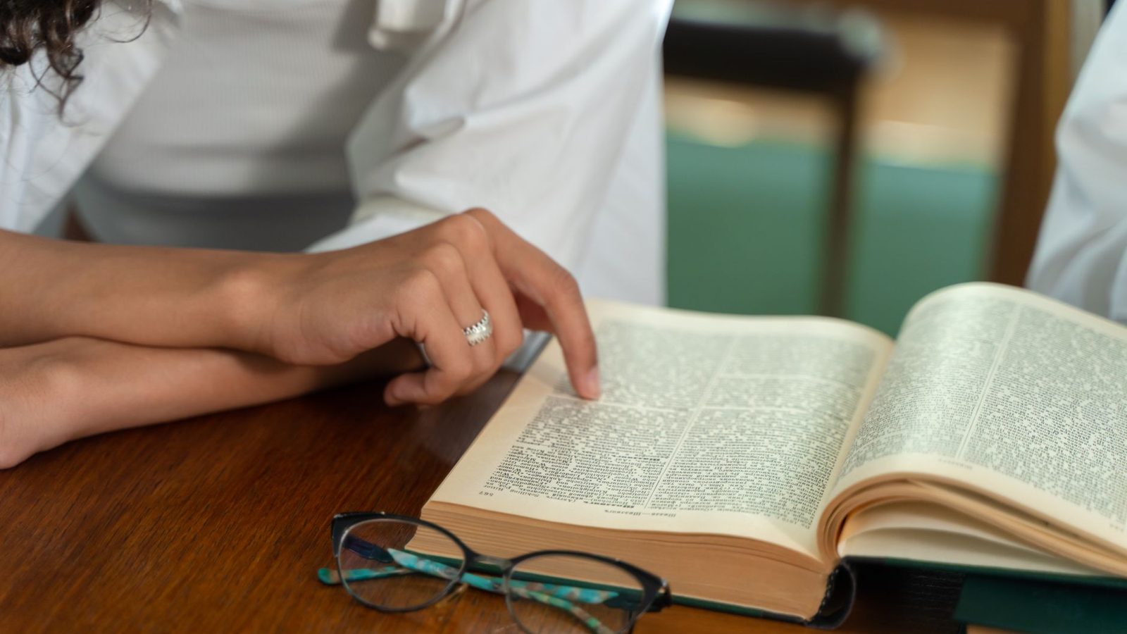 An open dictionary on a desk